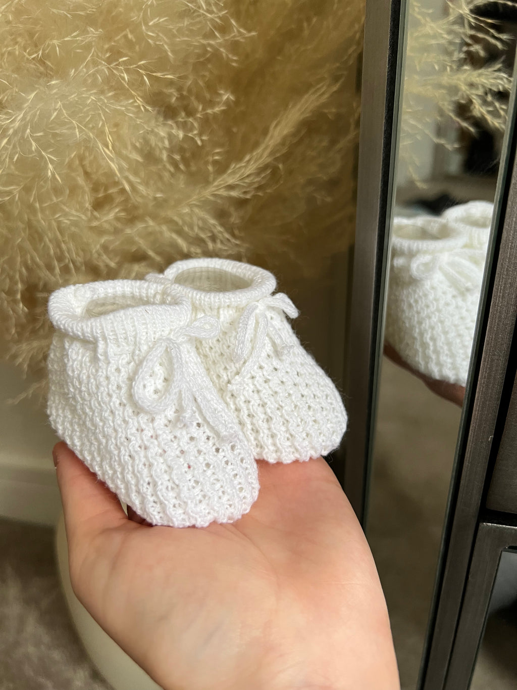 White knitted booties