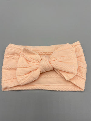 Peach cable knit headband