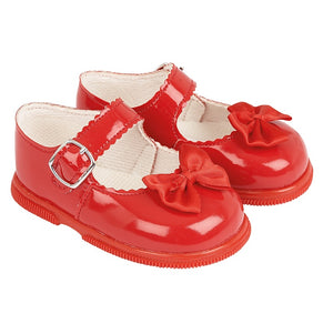 Red patent bows shoes